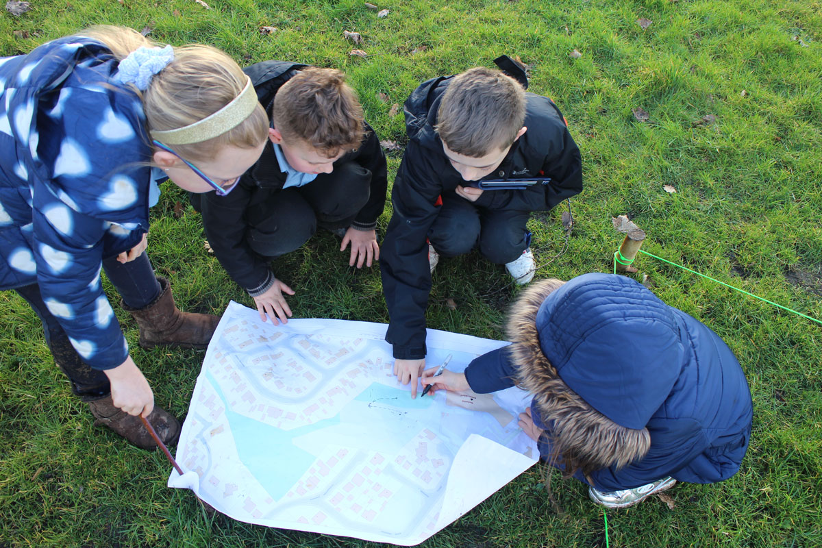 Pupils from Craigbank Primary School, Larkhall, explore the new Make Your Way - Larkhall maps created through the project